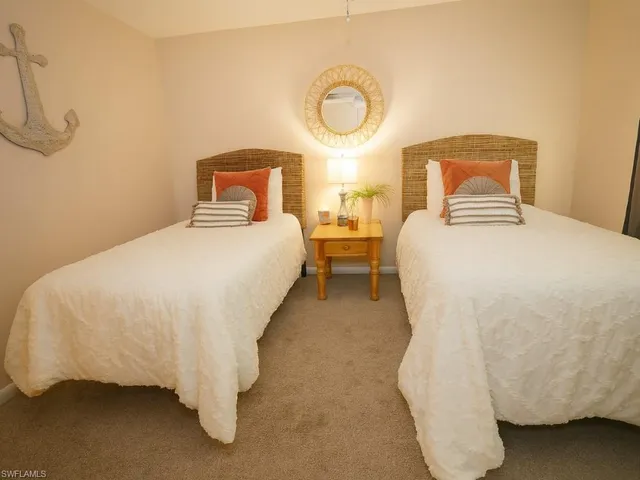 a bedroom with a bed and a cabinets