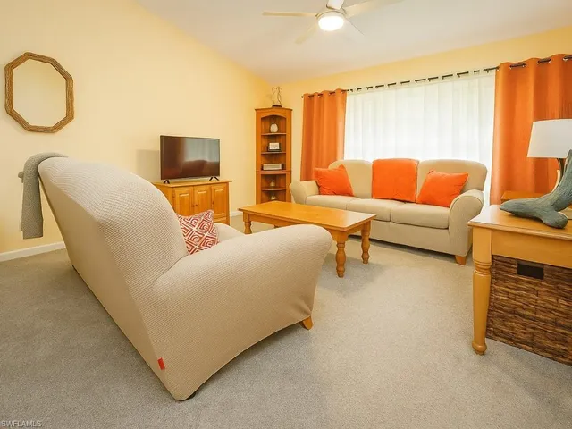 a living room with furniture and a couch