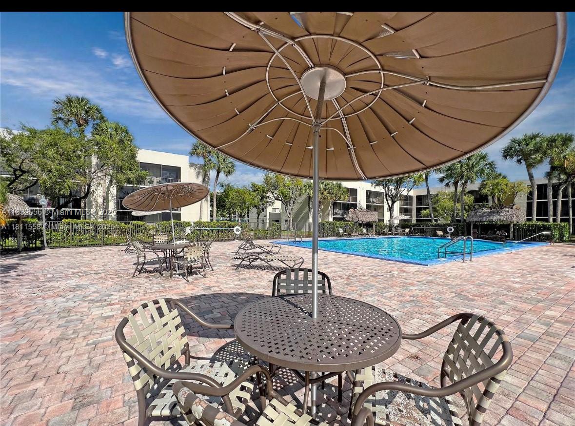 Kendall Miami, FL 33173 - Photo 17 of 20 a patio with a patio table and chairs