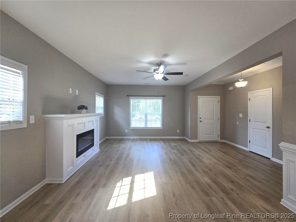 7018 Summerlin Drive Fayetteville, NC 28306 - Photo 11 of 39 a view of an empty room with wooden floor and a window