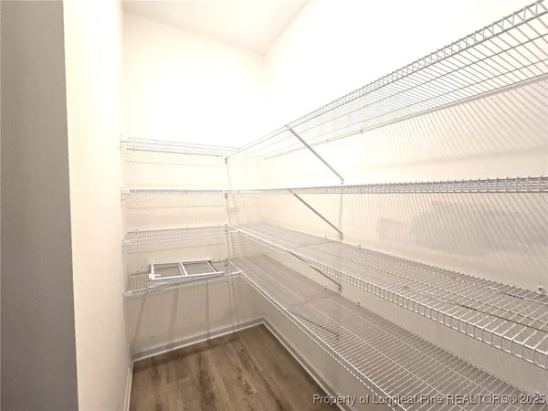 a view of a room with racks on the wall