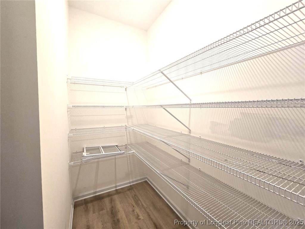 7018 Summerlin Drive Fayetteville, NC 28306 - Photo 18 of 39 a view of a room with racks on the wall