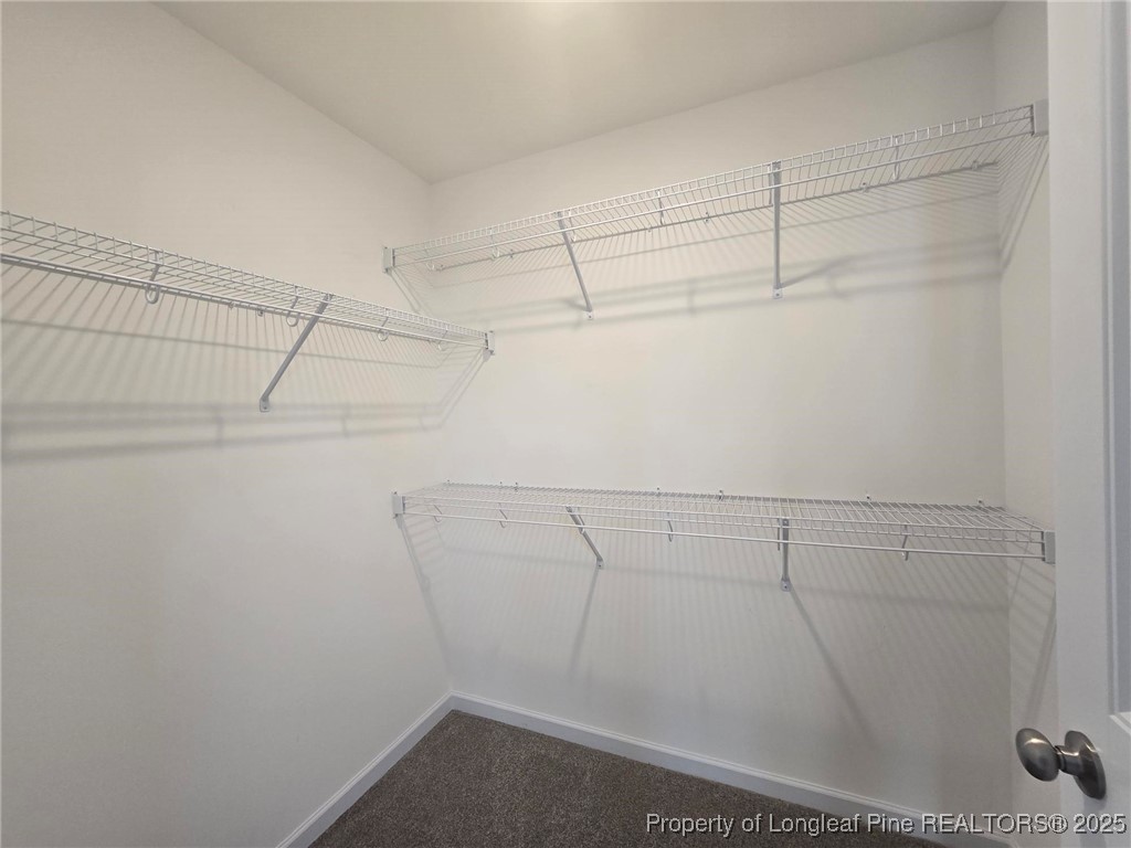 7018 Summerlin Drive Fayetteville, NC 28306 - Photo 27 of 39 a view of a room with racks on the wall