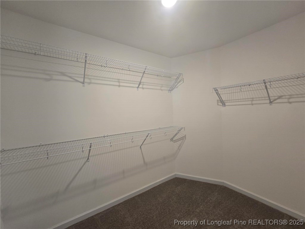 7018 Summerlin Drive Fayetteville, NC 28306 - Photo 28 of 39 a view of a room with racks on the wall