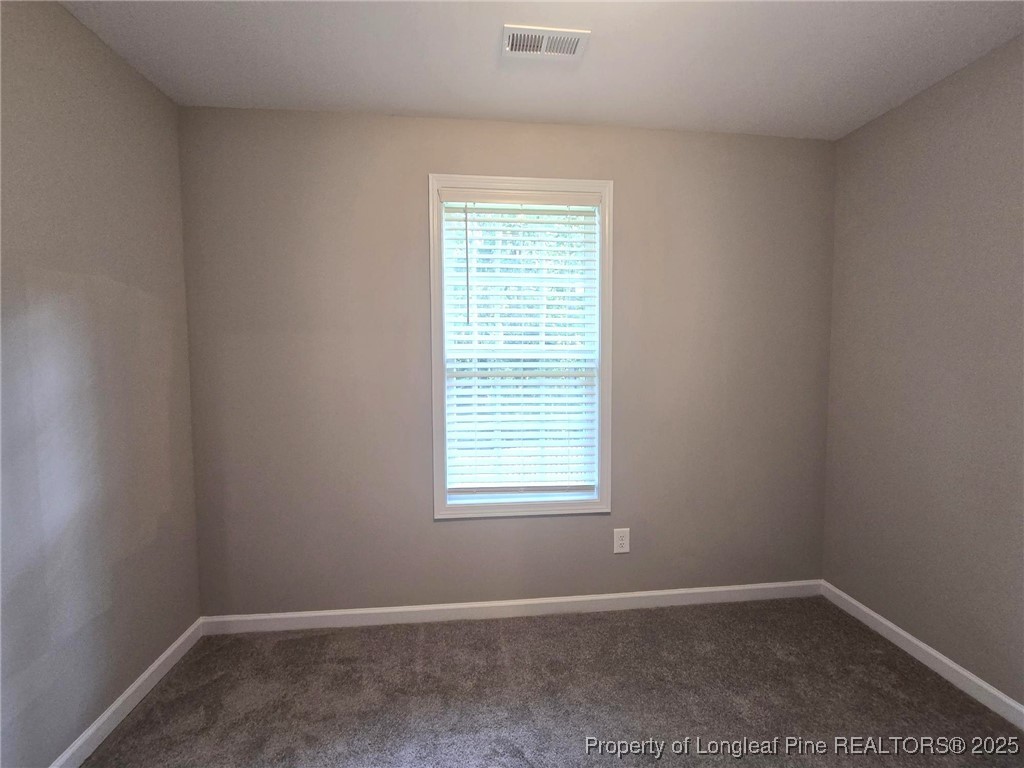 7018 Summerlin Drive Fayetteville, NC 28306 - Photo 38 of 39 an empty room with a window