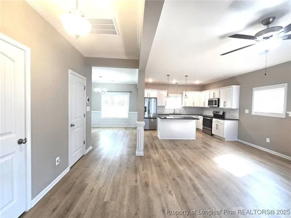 a view of kitchen with wooden floor