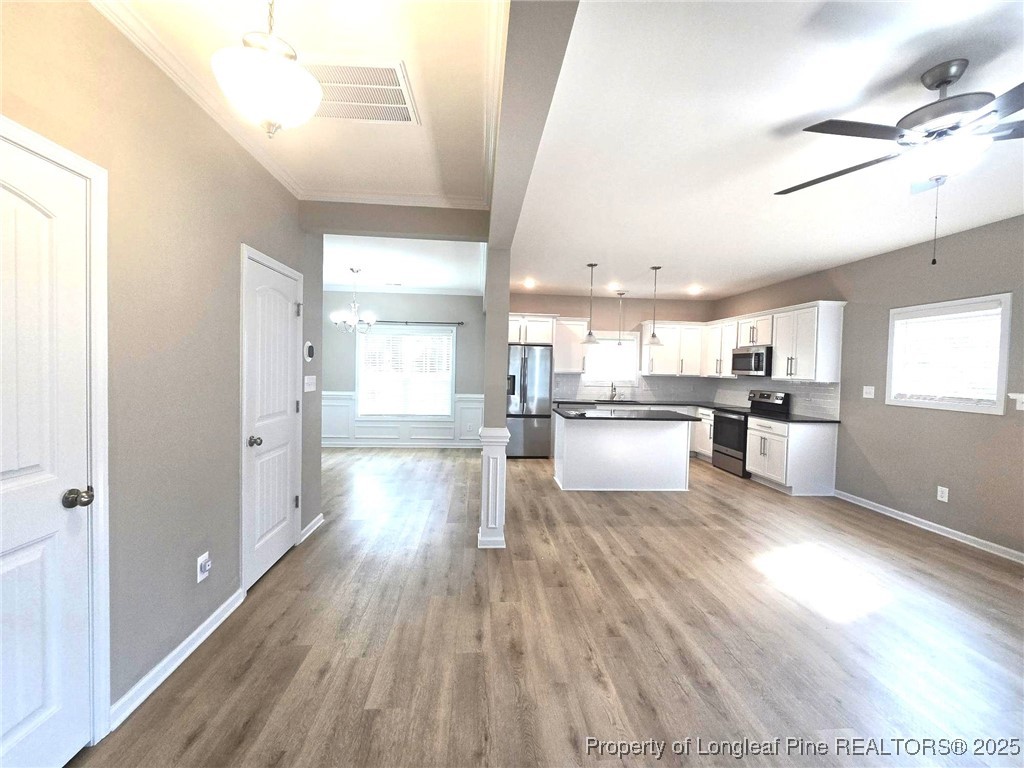 7018 Summerlin Drive Fayetteville, NC 28306 - Photo 6 of 39 a view of kitchen with wooden floor