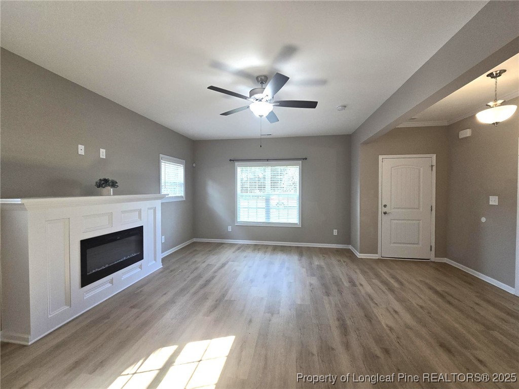 7018 Summerlin Drive Fayetteville, NC 28306 - Photo 8 of 39 a view of an empty room with a fireplace and a window