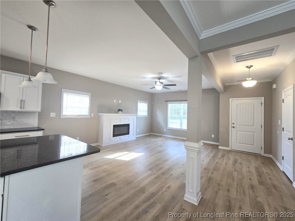 7018 Summerlin Drive Fayetteville, NC 28306 - Photo 10 of 39 a view of a kitchen with a sink dishwasher and fireplace