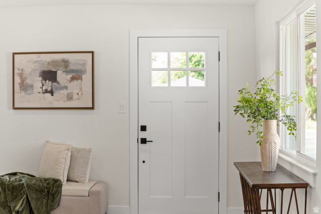 189 West Center Street Midvale, UT 84047 - Photo 4 of 64 Entryway featuring a white paneled door with glass inserts, matte black hardware, and a large window with white trim