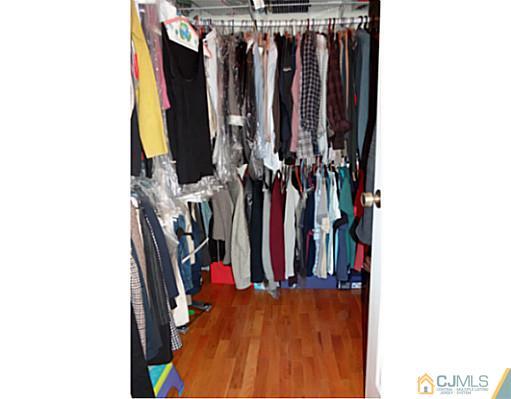 3403 Springbrook Drive Edison, NJ 08820 - Photo 24 of 24 a view of walk in closet with clothes
