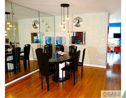 3403 Springbrook Drive Edison, NJ 08820 - Photo 8 of 24 a view of a dining room with furniture and wooden floor