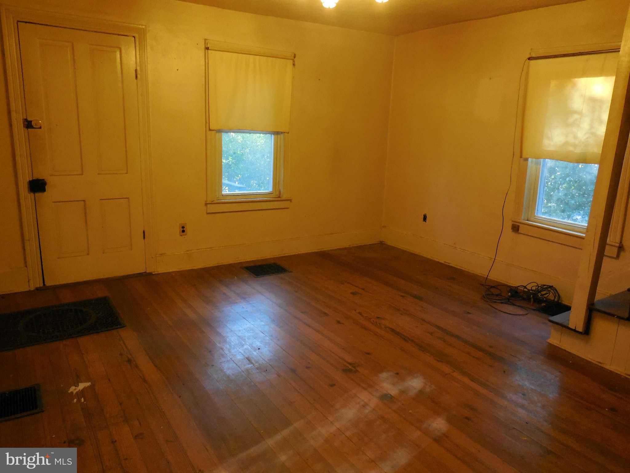 Living Room w/Ft Door to roomy Porch