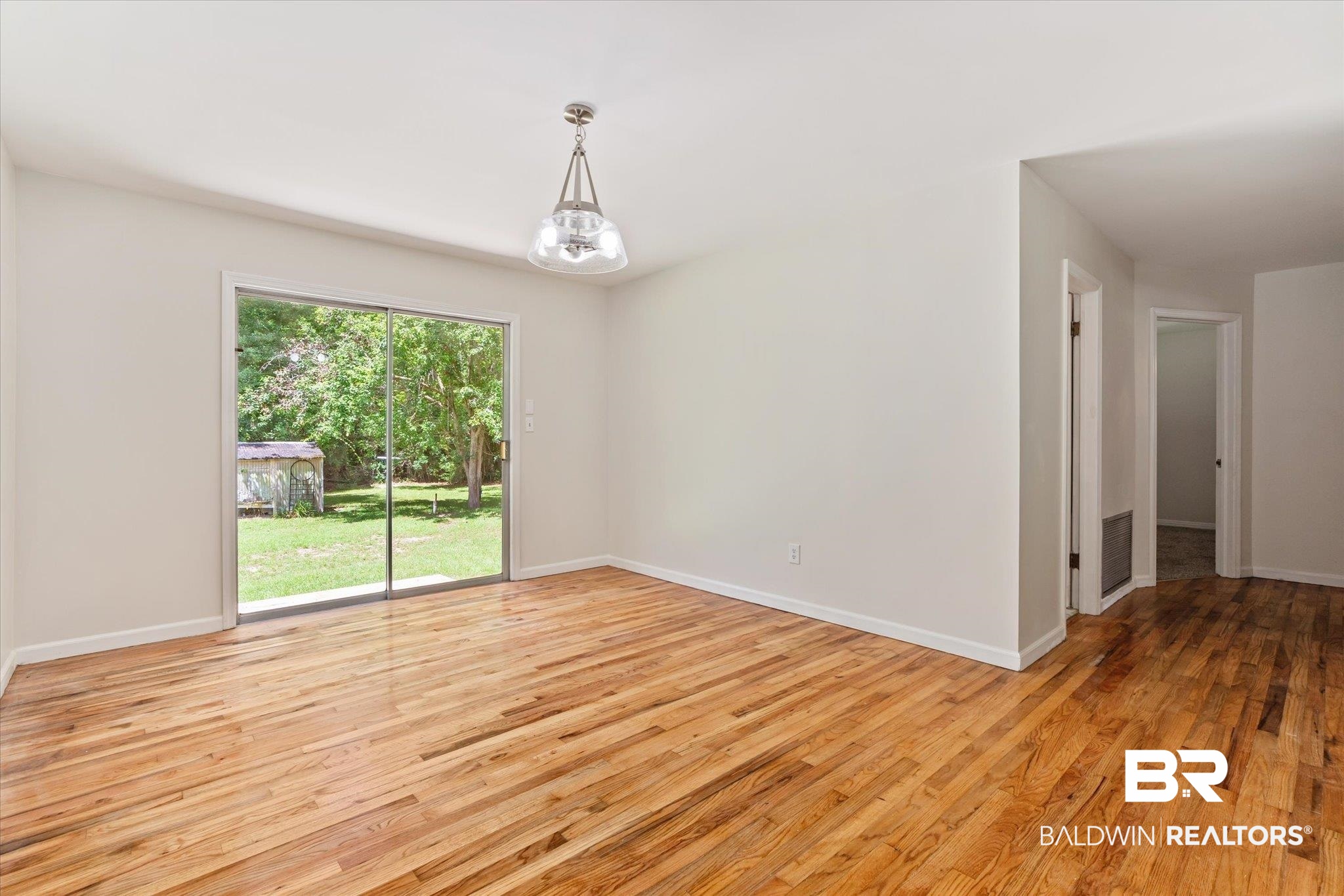 3325 Lacoste Road Mobile, AL 36618 - Photo 4 of 35 Empty room featuring light wood-type flooring