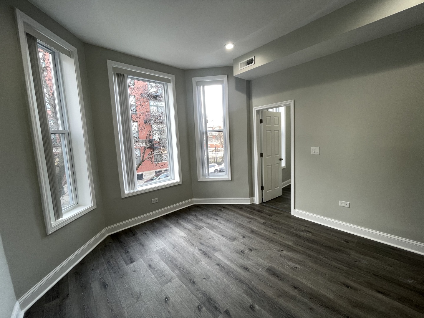 930 West 35th Street, Unit 2F Chicago, IL 60609 - Photo 13 of 13 an empty room with wooden floor and windows