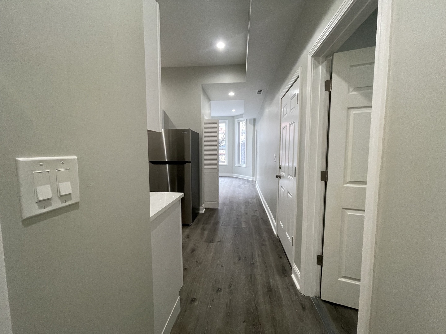 930 West 35th Street, Unit 2F Chicago, IL 60609 - Photo 3 of 13 a view of a hallway with wooden floor