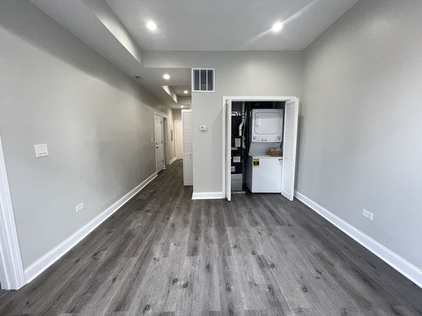 930 West 35th Street, Unit 2F Chicago, IL 60609 - Photo 8 of 13 wooden floor in an empty room with a window
