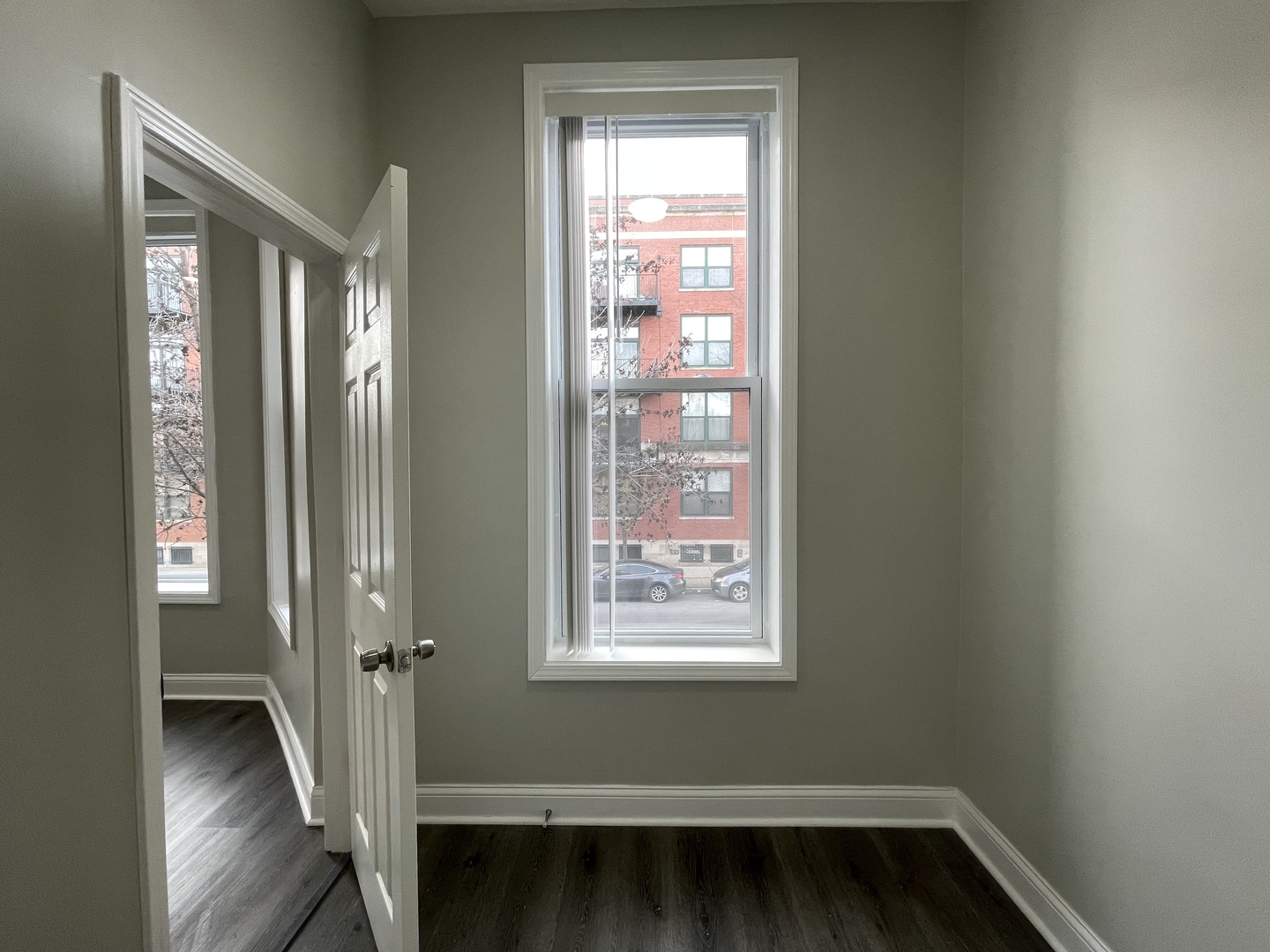 930 West 35th Street, Unit 2F Chicago, IL 60609 - Photo 9 of 13 a view of front door with wooden floor