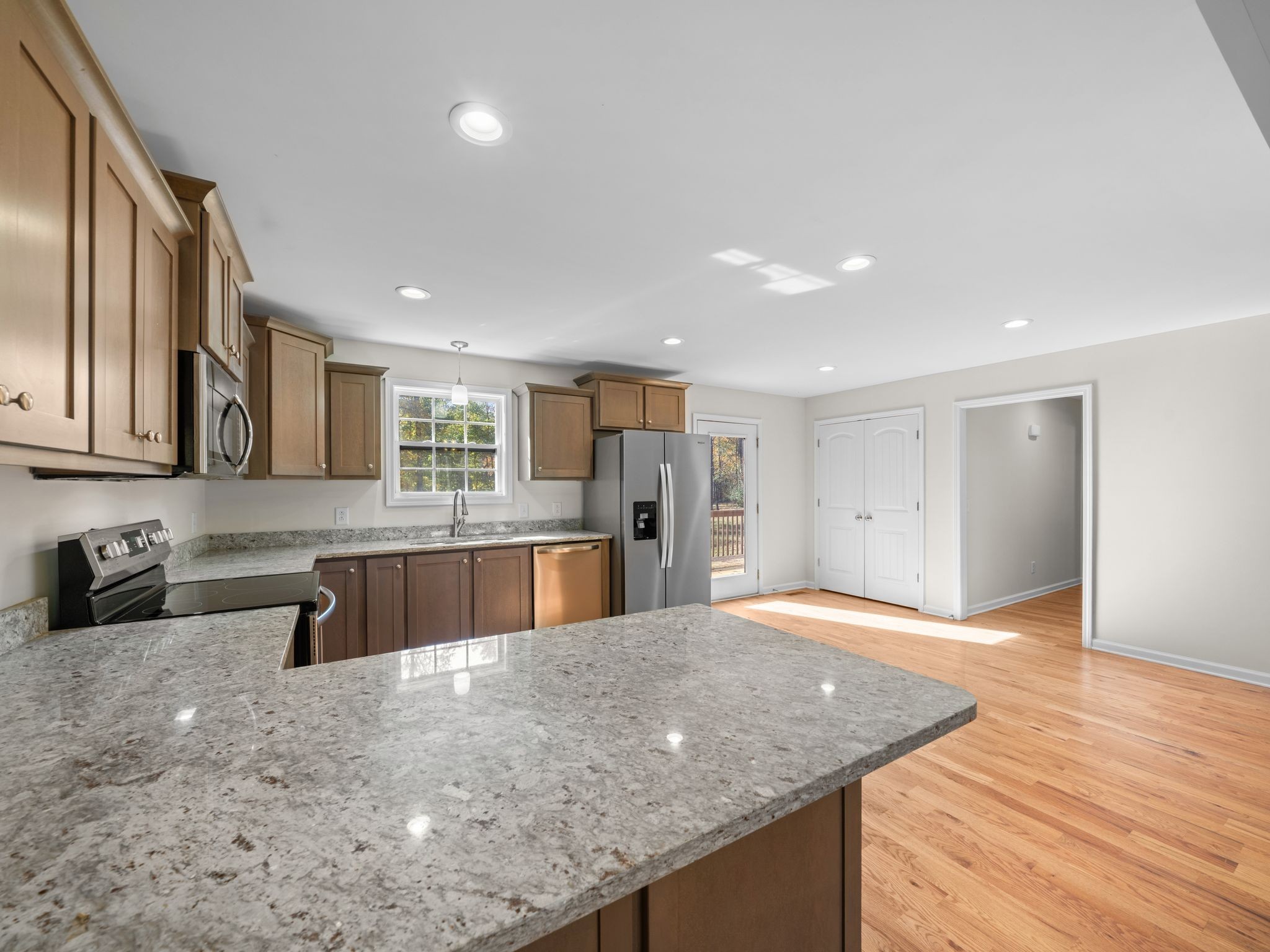 4413 Taylor Road Springfield, TN 37172 - Photo 12 of 28 a large kitchen with stainless steel appliances granite countertop a granite counter tops and a view of living room