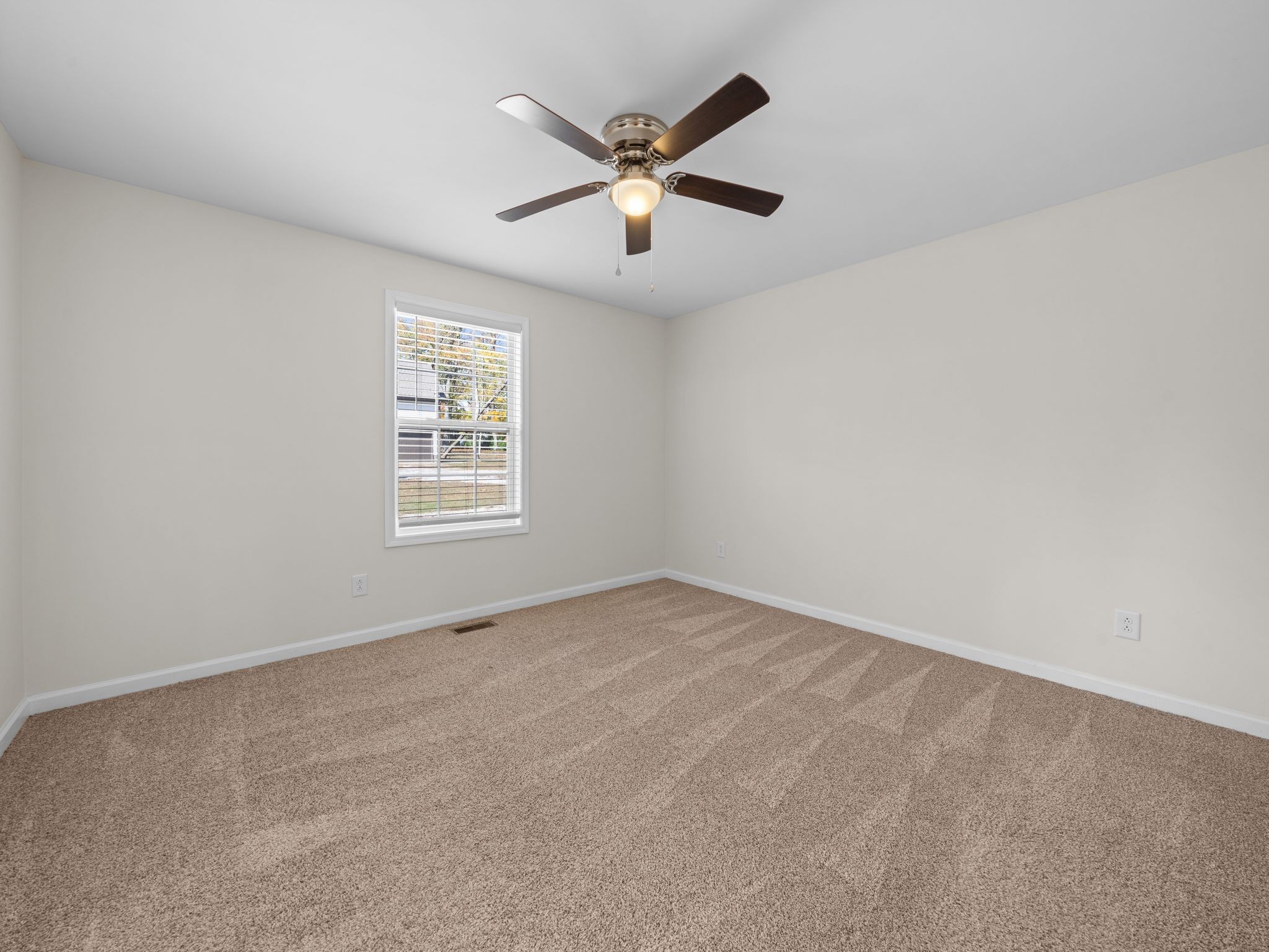4413 Taylor Road Springfield, TN 37172 - Photo 18 of 28 an empty room with ceiling fan and window