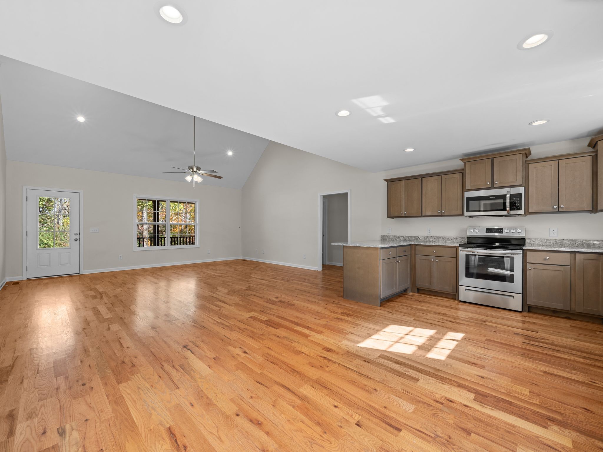 4413 Taylor Road Springfield, TN 37172 - Photo 9 of 28 a view of kitchen with wooden floor electronic appliances and window