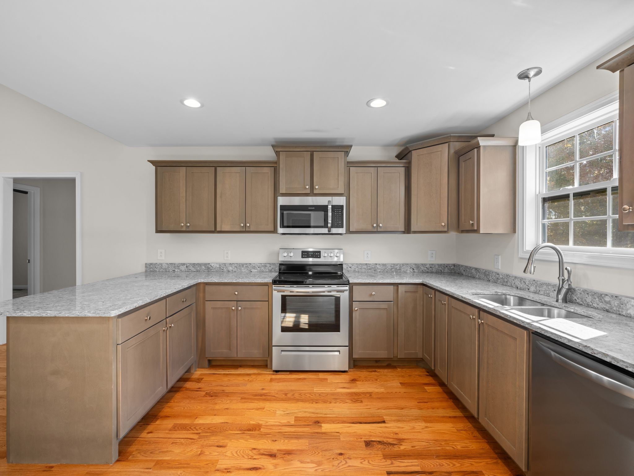 4413 Taylor Road Springfield, TN 37172 - Photo 10 of 28 a kitchen with stainless steel appliances granite countertop a sink stove and cabinets