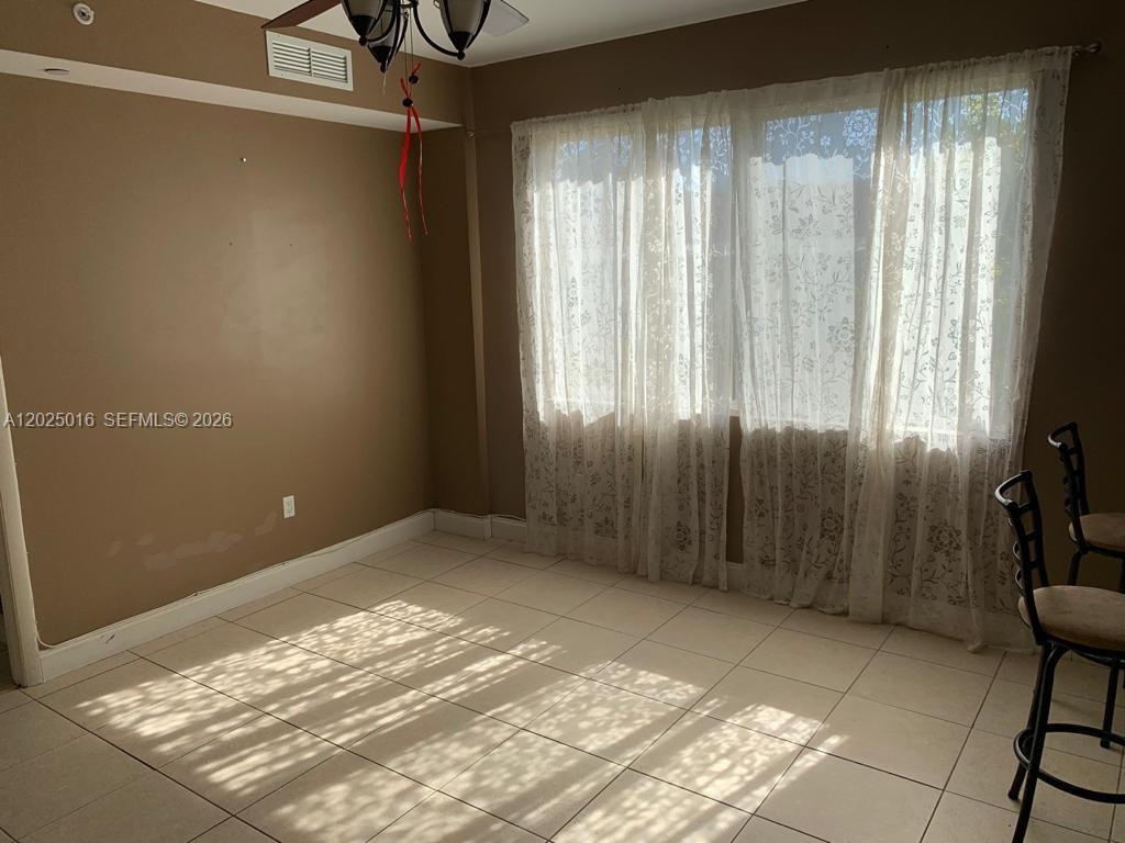 400 Southwest 2nd Street, Unit 201 Miami, FL 33130 - Photo 3 of 12 a view of an empty room and window
