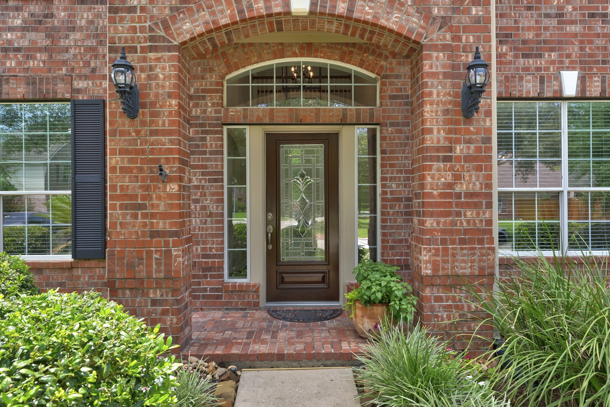 6643 Knollbridge Lane Spring, TX 77379 - Photo 3 of 50 Great curb appeal with sophisticated brick and covered front porch.
