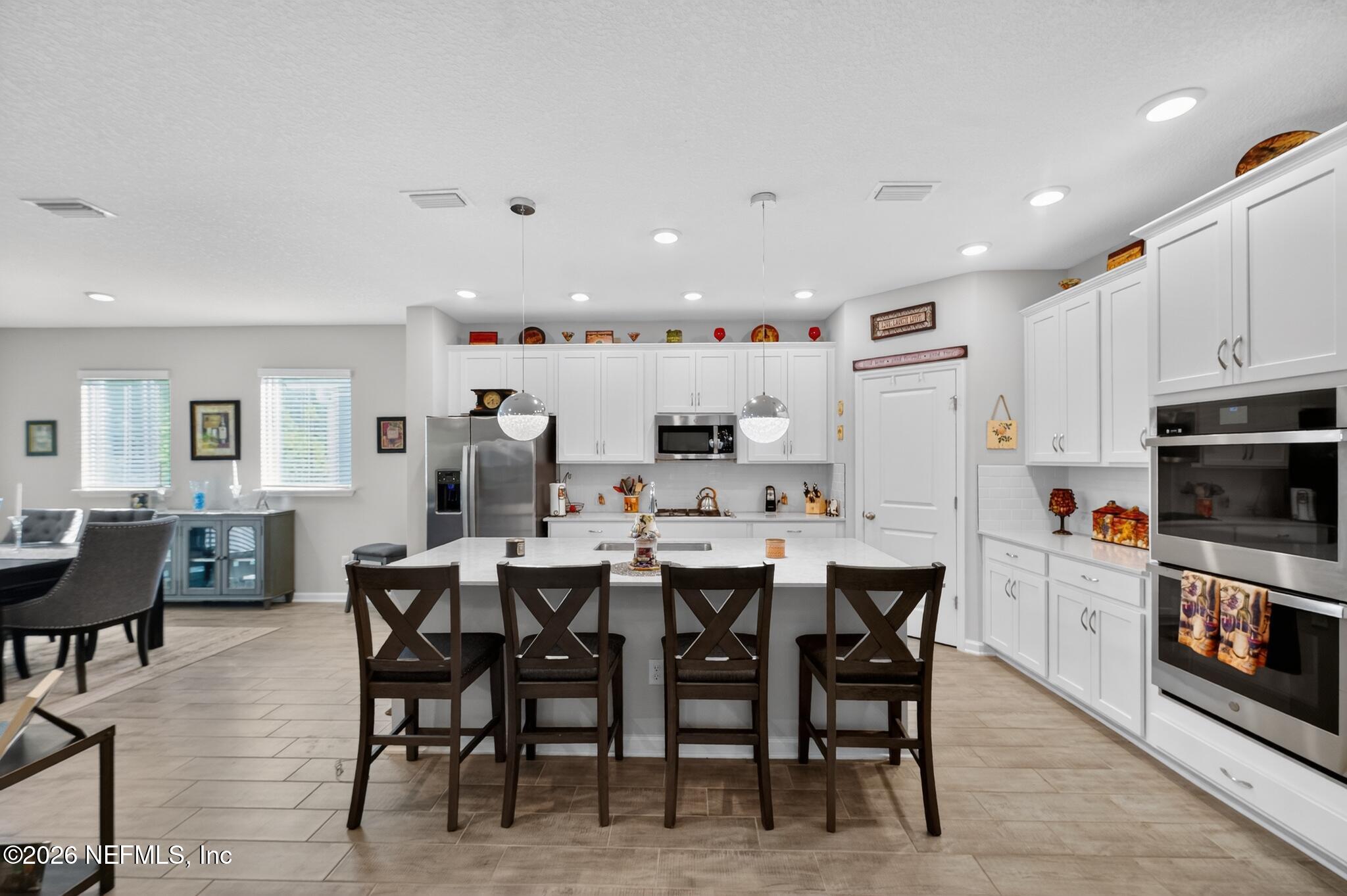 75505 Banyan Way Yulee, FL 32097 - Photo 13 of 30 a large kitchen with a table and chairs