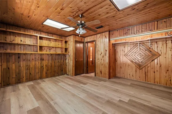 a view of a room with wooden walls