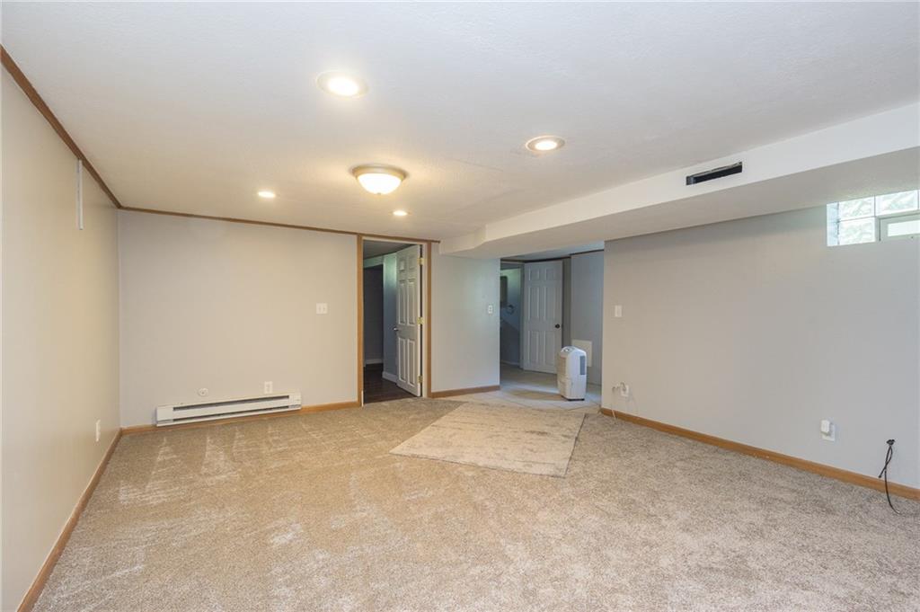 16 Engle Road Industry, PA 15052 - Photo 12 of 23 Family room in basement is ready for enjoying with new carpet and paint! There is a lot of privacy provided with separate entrance- great for mother-in-law, teenager, or young adult.