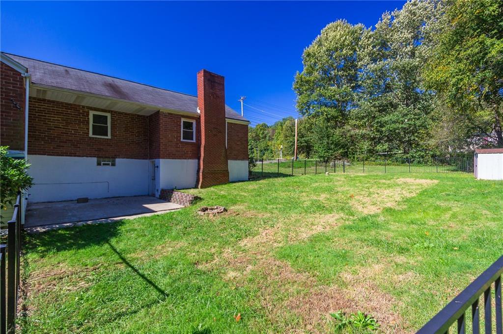 16 Engle Road Industry, PA 15052 - Photo 17 of 23 Back cement patio and small fire pit area. A great place to sit and enjoy BBQ with family/ friends.