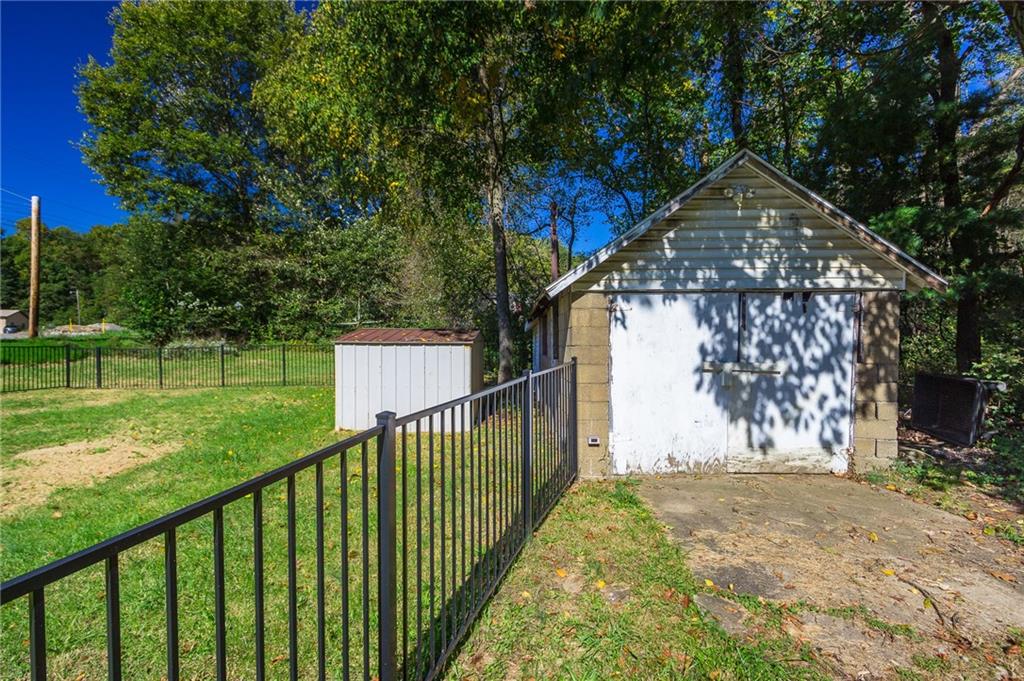 16 Engle Road Industry, PA 15052 - Photo 18 of 23 1 car detached garage with electric. There is also an attached shed with electric behind the garage. Was originally built as a kids playhouse but could make a great "she shed" with some work!