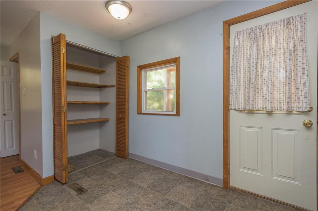 16 Engle Road Industry, PA 15052 - Photo 7 of 23 Kitchen pantry and enough room for a small kitchen table/chairs. Back door leads to small private wooden deck.