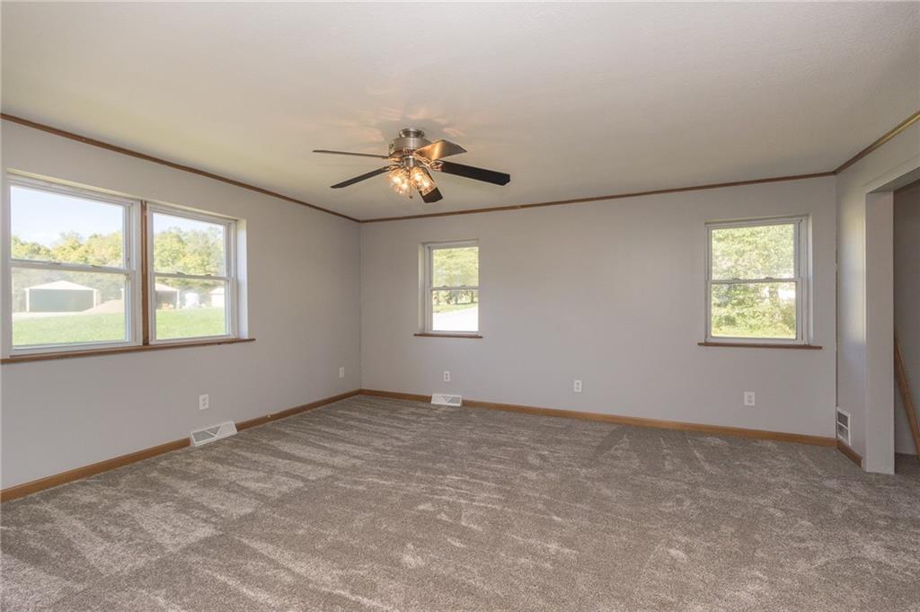16 Engle Road Industry, PA 15052 - Photo 8 of 23 Windows galore for natural light! New paint and carpet in the mater bedroom!