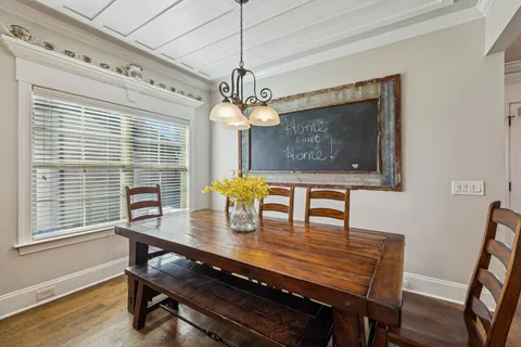 a kitchen with stainless steel appliances granite countertop a refrigerator a stove top oven a sink and dishwasher