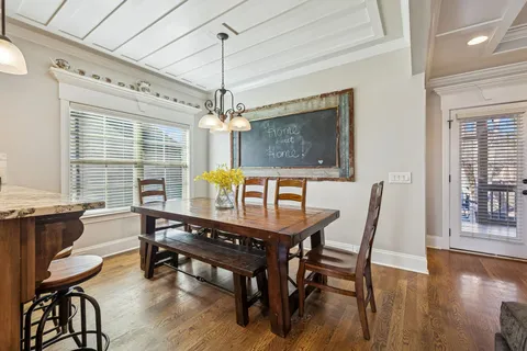 a kitchen with granite countertop a refrigerator and a sink