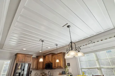 a view of a livingroom with workspace and a window