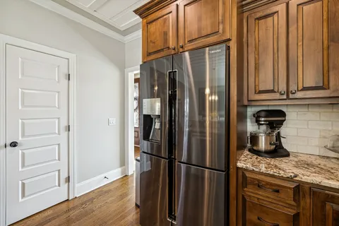 a spacious bathroom with a tub sink and mirror