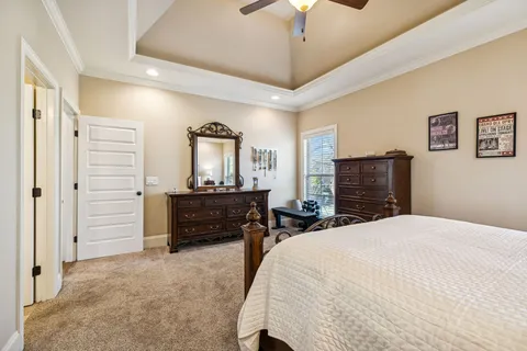 a bedroom with a bed and a sink