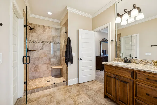 a bedroom with two beds and a lamp