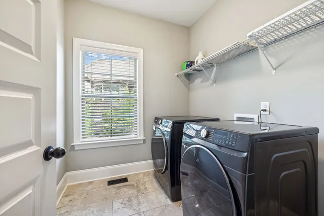 a view of a chairs and table in backyard