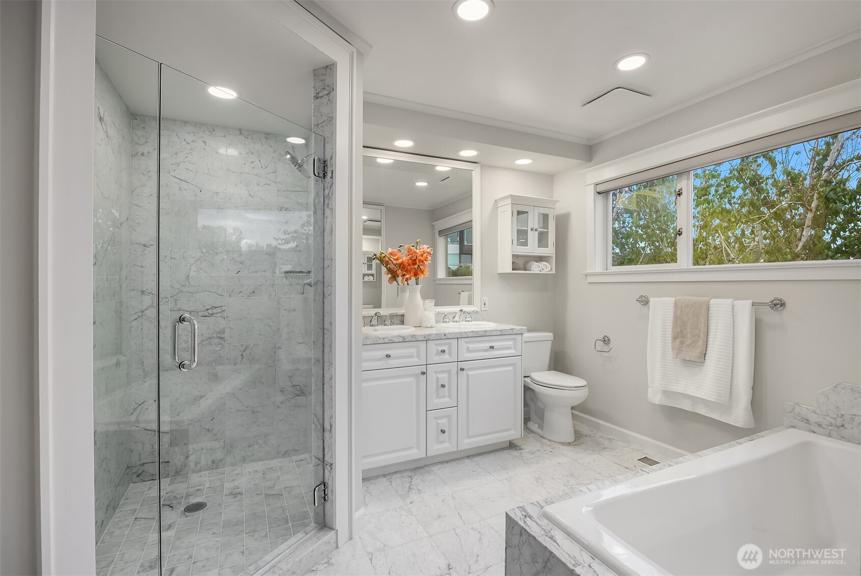 525 West Prospect Street, Unit A Seattle, WA 98119 - Photo 14 of 31 a bathroom with a granite countertop sink a toilet and shower