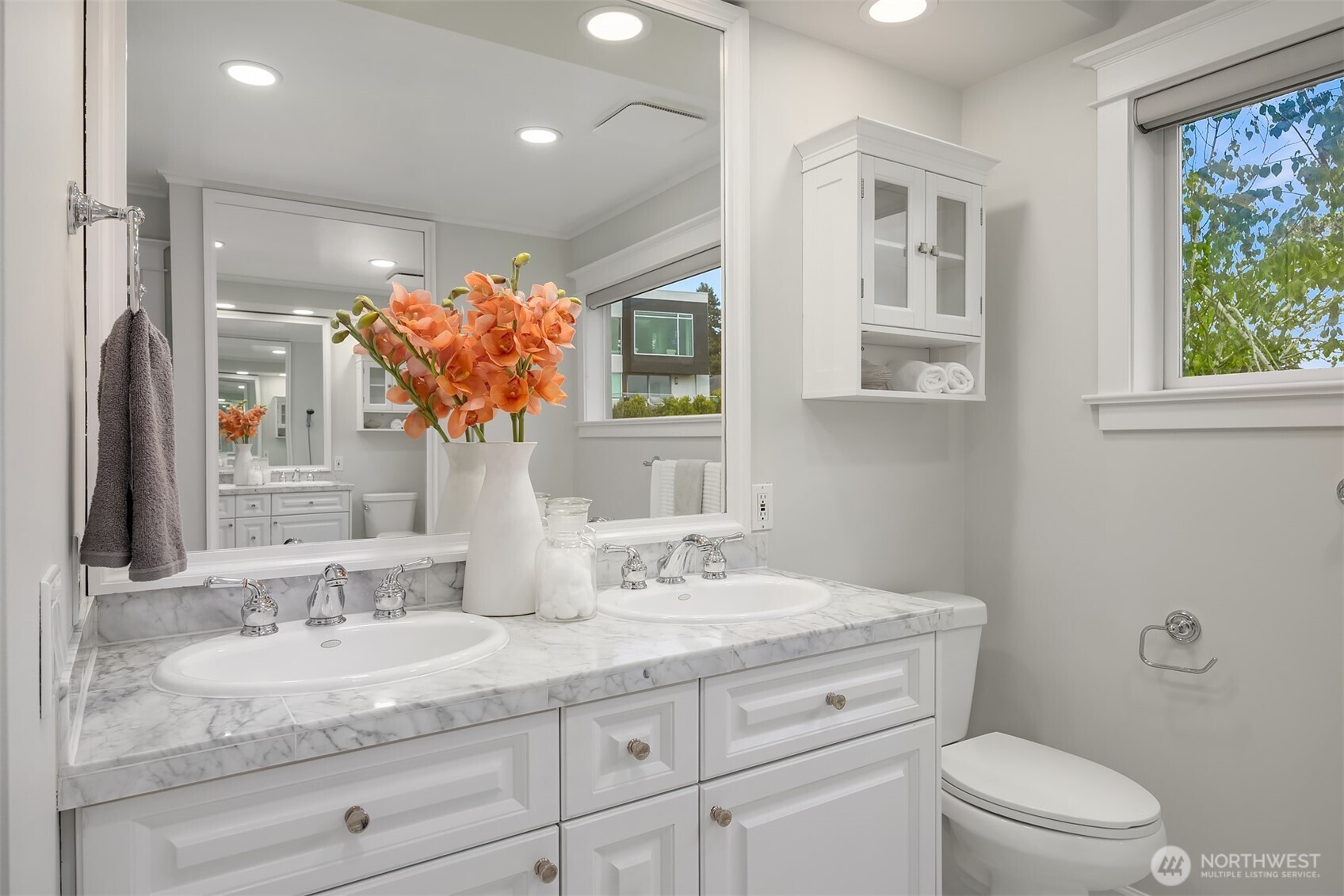 525 West Prospect Street, Unit A Seattle, WA 98119 - Photo 16 of 31 a bathroom with a granite countertop sink a toilet and a mirror