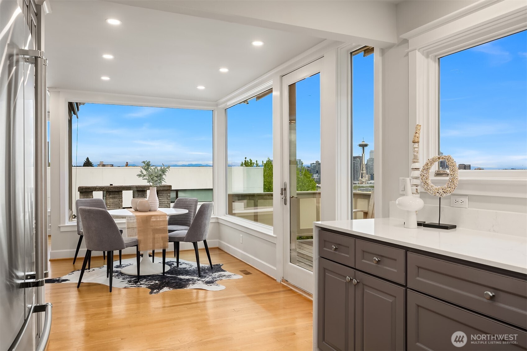 525 West Prospect Street, Unit A Seattle, WA 98119 - Photo 6 of 31 a dining room with furniture and wooden floor