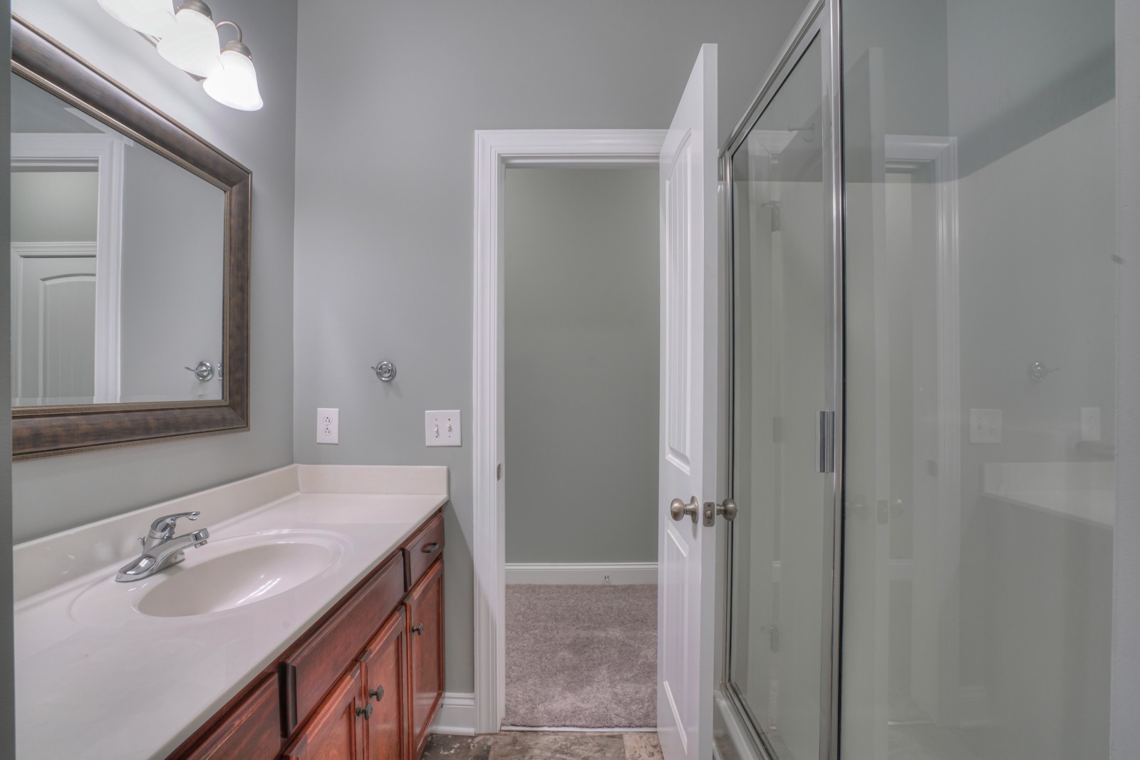 214 Rowlette Circle Murfreesboro, TN 37127 - Photo 17 of 27 a bathroom with a sink and a mirror