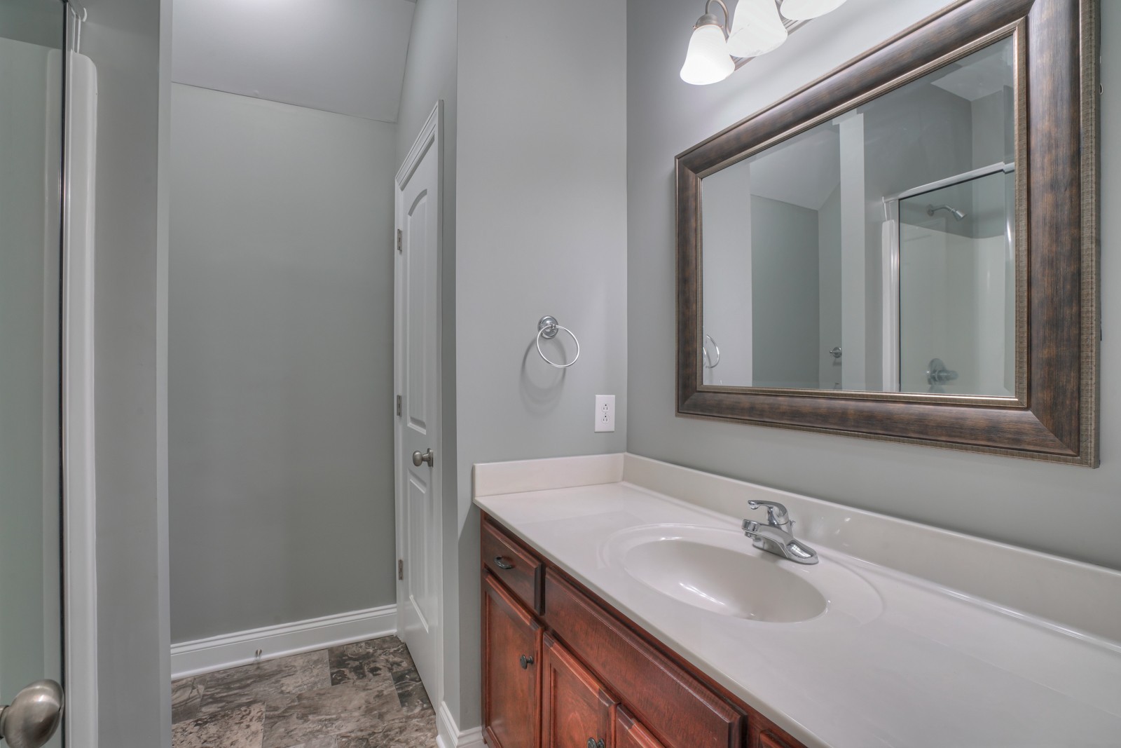 214 Rowlette Circle Murfreesboro, TN 37127 - Photo 18 of 27 a bathroom with a sink and a mirror