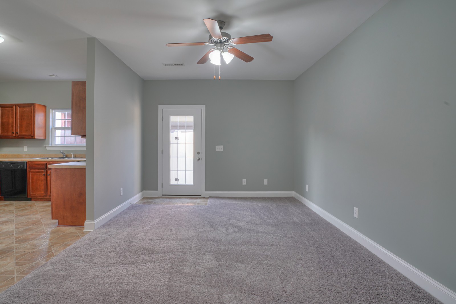 214 Rowlette Circle Murfreesboro, TN 37127 - Photo 4 of 27 an empty room with chandelier fan and kitchen view