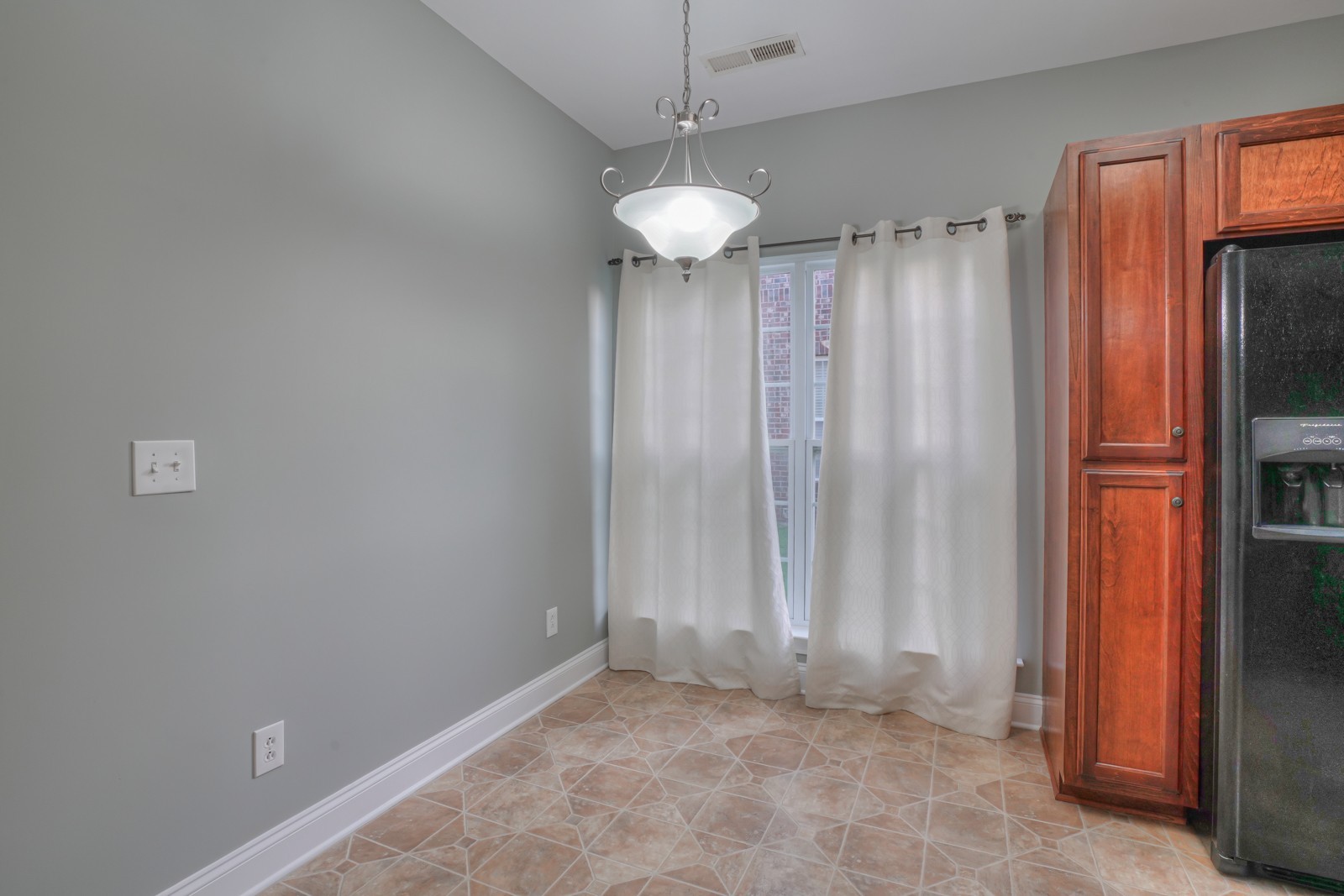 214 Rowlette Circle Murfreesboro, TN 37127 - Photo 6 of 27 a view of a room with a refrigerator and a window