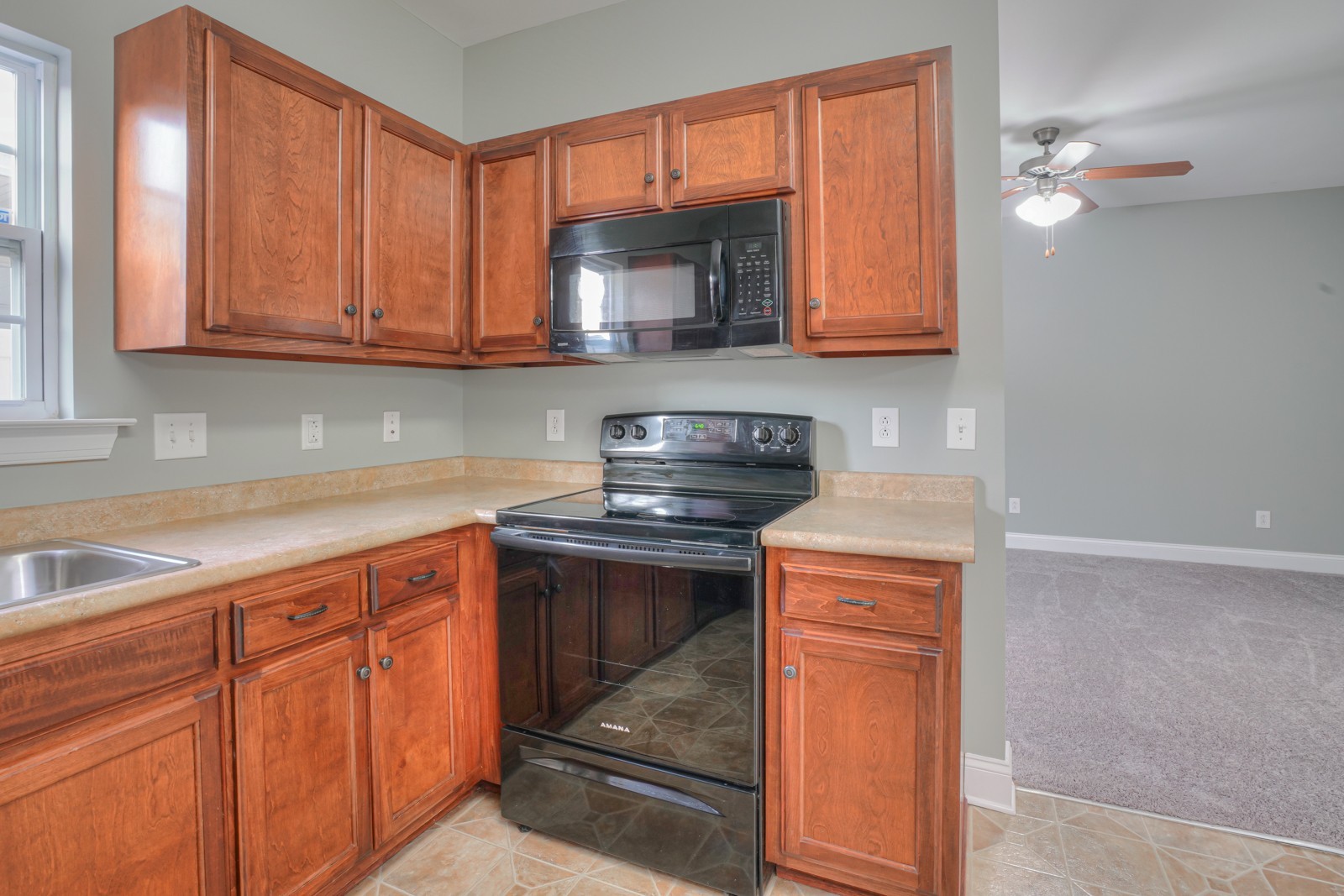 214 Rowlette Circle Murfreesboro, TN 37127 - Photo 7 of 27 a kitchen with stainless steel appliances granite countertop a sink stove and cabinets